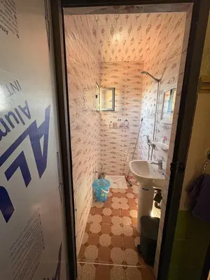 a small bathroom with a sink and a toilet at Airport appartement , penthouse in Marrakech