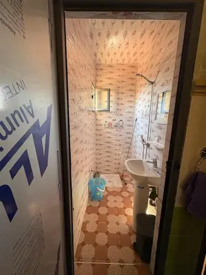 a bathroom with a sink and a toilet and a shower at Airport appartement , penthouse in Marrakech