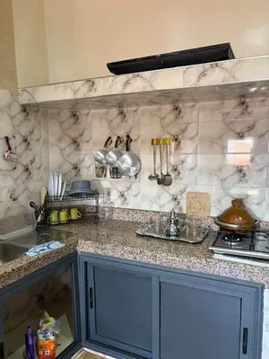 a kitchen with a counter and a counter top with a counter sidx sidx at Airport appartement , penthouse in Marrakech