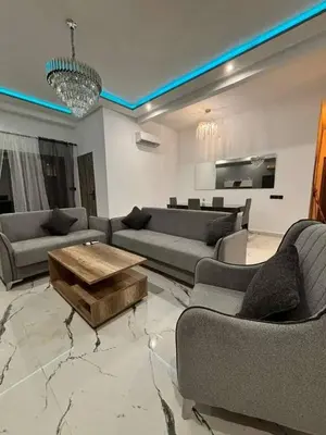 a living room with couches and a coffee table at Appartement moderne in Marrakech