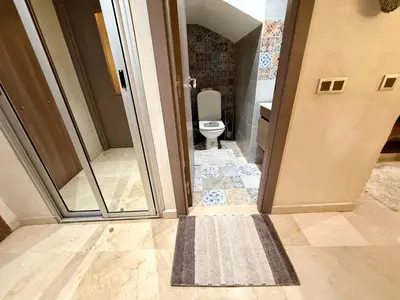 an open door to a bathroom with a toilet at Maison H&A in Marrakech