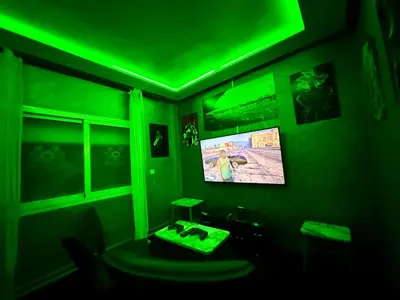 a green light in a room with a tv at Maison H&A in Marrakech