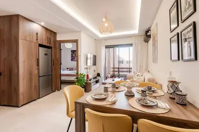 a kitchen and dining room with a table and chairs at Berber Atlas Marrakech with Pool in Marrakech
