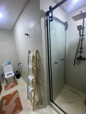 a bathroom with a shower and a toilet at Berber Atlas Marrakech with Pool in Marrakech