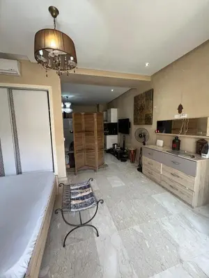 a large room with a bed and a kitchen at nice apartment and good location in Marrakech