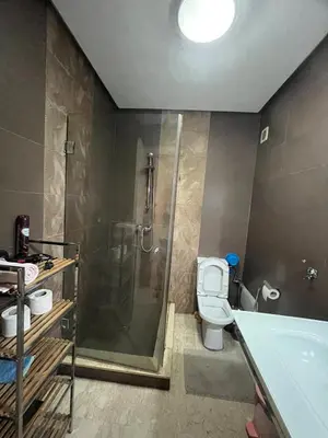 a bathroom with a shower and a toilet and a sink at nice apartment and good location in Marrakech