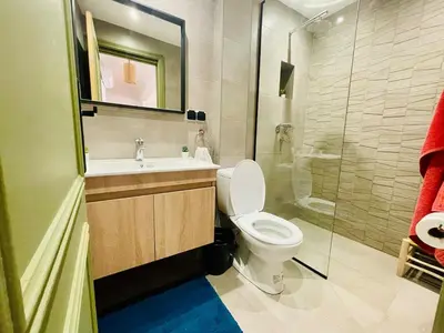 a bathroom with a toilet and a sink and a shower at Bright Place and High Quality Mattress in Marrakech