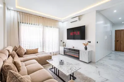 a living room with a couch and a fireplace at Cocoon in Gueliz, Netflix, IPTV in Marrakech