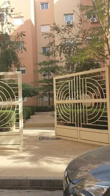 two gates on a sidewalk in front of a building at A Thousand and One Night Dream in Marrakech in Marrakech