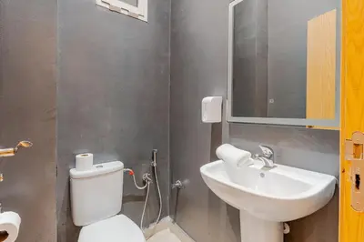 a bathroom with a white toilet and a sink at A Thousand and One Night Dream in Marrakech in Marrakech