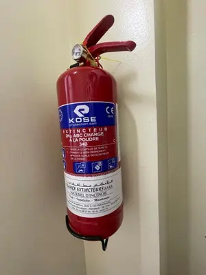 a fire extinguisher is attached to a wall at A Thousand and One Night Dream in Marrakech in Marrakech
