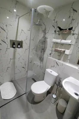 a bathroom with a toilet and a sink at Cozy Apt in Heart of Marrakech, Walk Everywhere in Marrakech