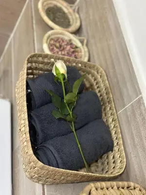 a basket with towels and a flower on top at Cozy apartment with a pool2 in Marrakech