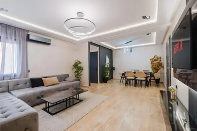 a living room with a couch and a table at Cozy Appartement in the heart of Gueliz Marrakech in Marrakech