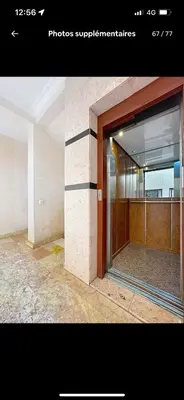 an open door of a building with a window at Big confort in Marrakech