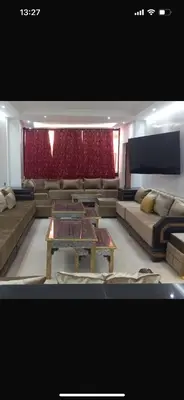 a living room with a couch and a table at Big confort in Marrakech
