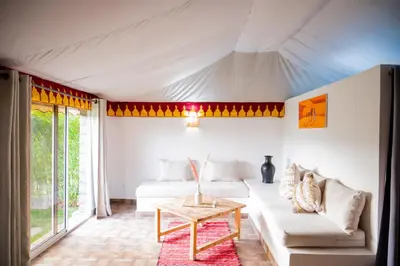 a living room with a couch and a table at Oléa villa & lodge in Marrakech