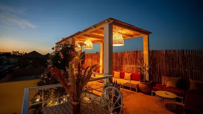a gazebo with a couch and a table on a balcony at Riad Dar Zioui in Marrakech
