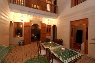 a dining room with a table and chairs at Riad Khalid Zrika Marrakech in Marrakech