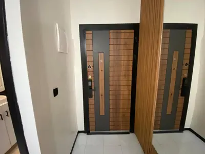 a hallway with two elevators in a building at Condominium in Marrakech
