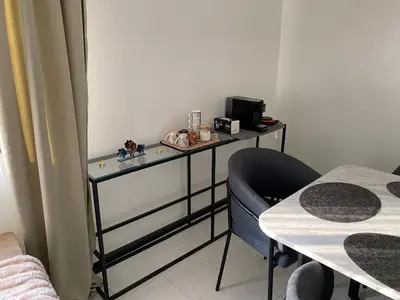 a room with a desk with a chair and a table at Condominium in Marrakech
