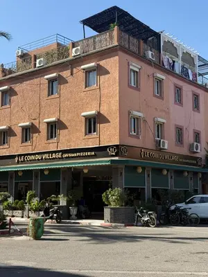 a large brick building with a sign on it at RIAD SAAD Marrakech in Marrakech