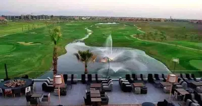 a view of the ninth green at the golf course at Cozy RC golf view pool & Atlas fiber optic 2 bedrooms in Marrakech