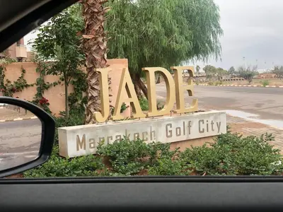 a sign for a moroccan golf city in a car at Cozy RC golf view pool & Atlas fiber optic 2 bedrooms in Marrakech