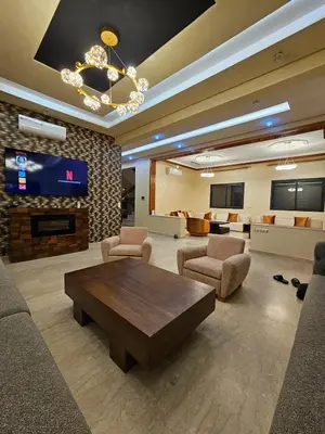 a living room with a couch and a table and chairs at Villa in Marrakech in Marrakech