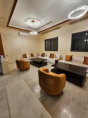 a large room with couches and tables and chairs at Villa in Marrakech in Marrakech