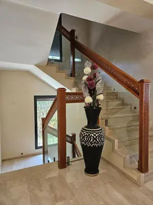 a staircase with a vase with flowers in it at Villa in Marrakech in Marrakech