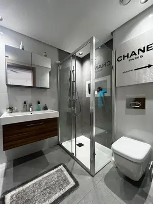 a bathroom with a shower and a toilet and a sink at Chanel home in Marrakech