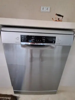 a stainless steel oven with a white counter top at L'ECRIN de la PALMERAIE in Dar Caïd Layadi