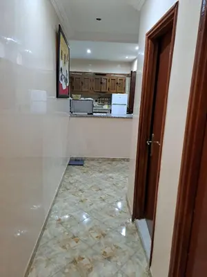 a room with a counter and a tile floor at Sweet home in Marrakech