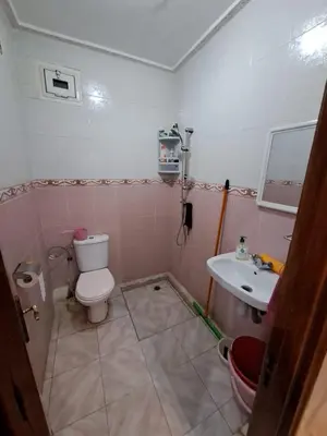a bathroom with a toilet and a sink at Sweet home in Marrakech