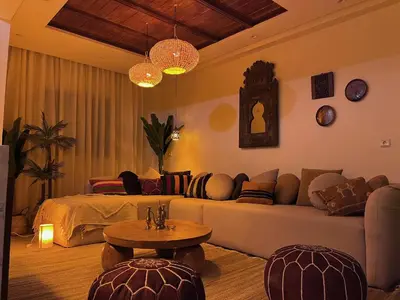 a living room with a couch and a table at Appartement Luxueux à Guéliz in Marrakech