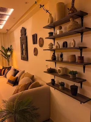 a room with shelves on the wall with a couch at Appartement Luxueux à Guéliz in Marrakech