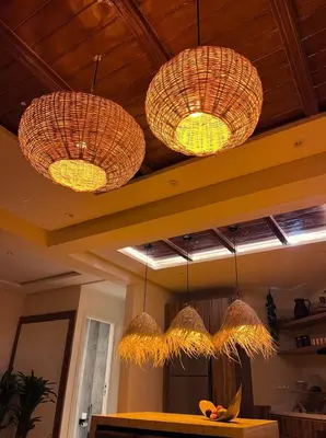three lights are hanging from the ceiling in a kitchen at Appartement Luxueux à Guéliz in Marrakech