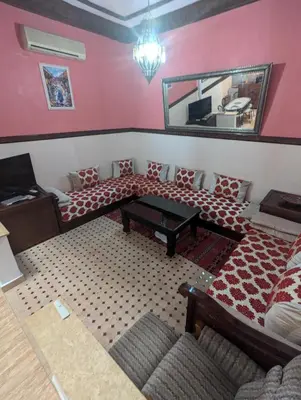 a living room with a couch and a table at riad rabiaa in Marrakech
