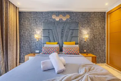a bedroom with a large bed with two pillows at AkHouse PB15 Fully Equipped - Guéliz TOP Center in Marrakech