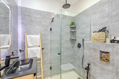a bathroom with a shower and a sink at Modern Apartment Gueliz City Center in Marrakech