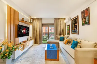 a living room with a couch and a table at PB16 Flat Fully Equipped Guéliz TOP Center in Marrakech
