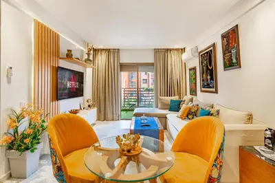 a living room with a couch and a table at PB16 Flat Fully Equipped Guéliz TOP Center in Marrakech