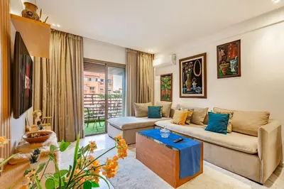 a living room with a couch and a table at PB16 Flat Fully Equipped Guéliz TOP Center in Marrakech