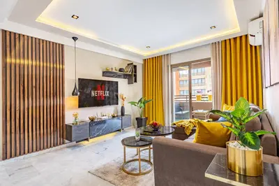 a living room with a couch and a table at Luxury CINÉMA-BEDROOM AK04 Guéliz-TopCenter in Marrakech