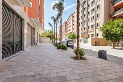an empty sidewalk in a city with buildings at HS14 Luxury 2Chambres Gueliz TopCenter in Marrakech