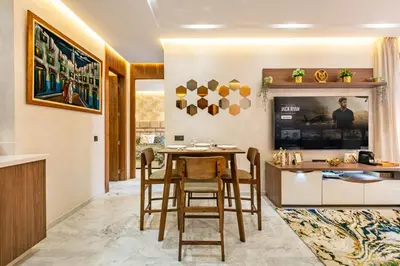 a kitchen and dining room with a table and chairs at HS14 Luxury 2Chambres Gueliz TopCenter in Marrakech