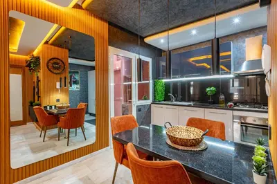 a kitchen with a table and chairs and a dining room at Cinéma Pool Unique Experience Mkesh Top10 in Marrakech