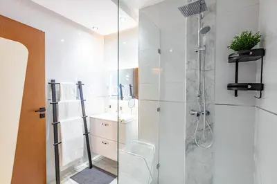 a bathroom with a shower and a toilet at Cinéma Pool Unique Experience Mkesh Top10 in Marrakech