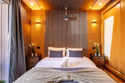 a bedroom with a large bed with a white animal on it at Cinéma Pool Unique Experience Mkesh Top10 in Marrakech